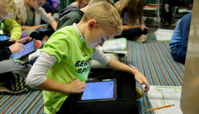 Discovery student with an electronic tablet