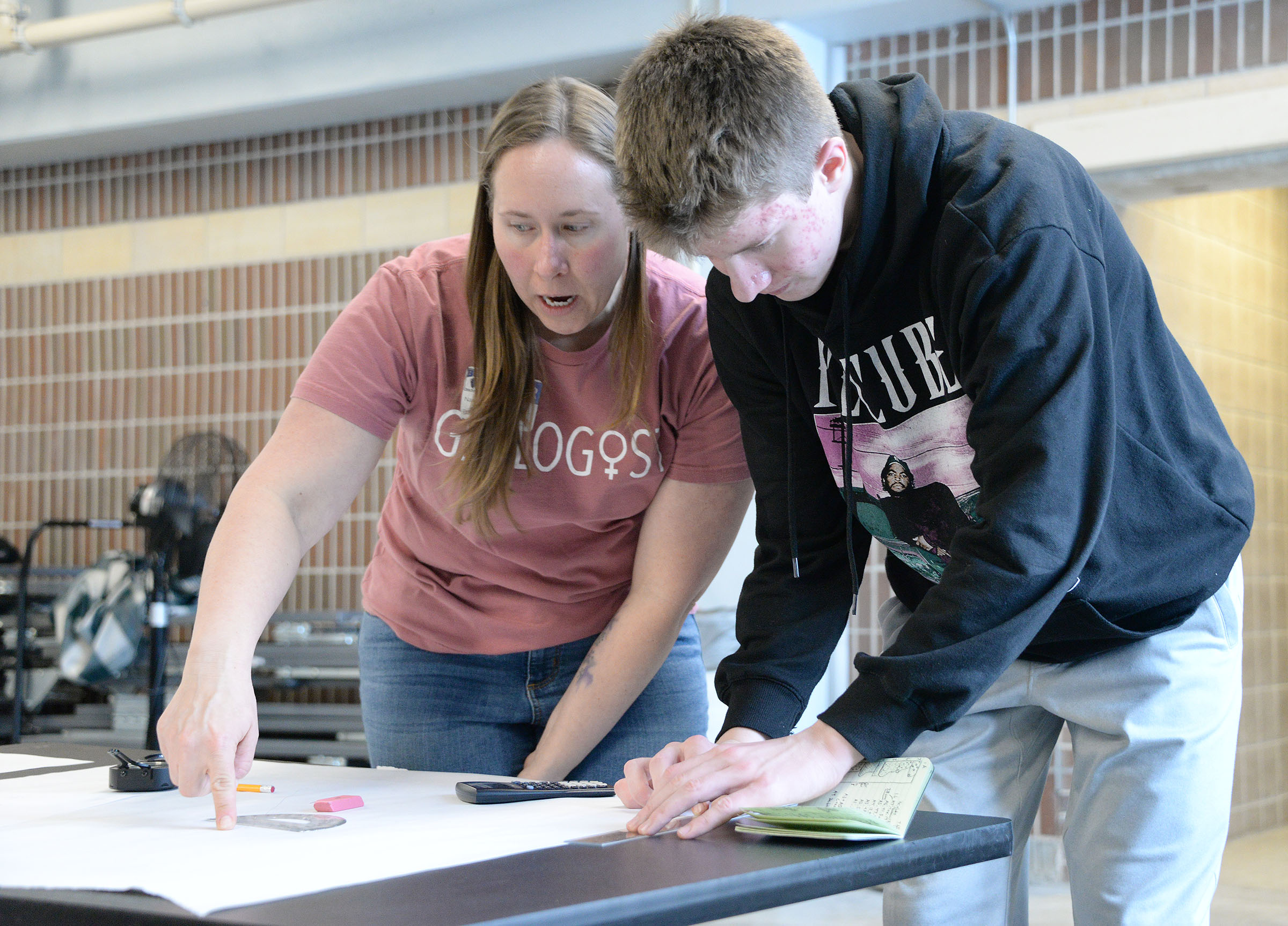 Geologist works with student