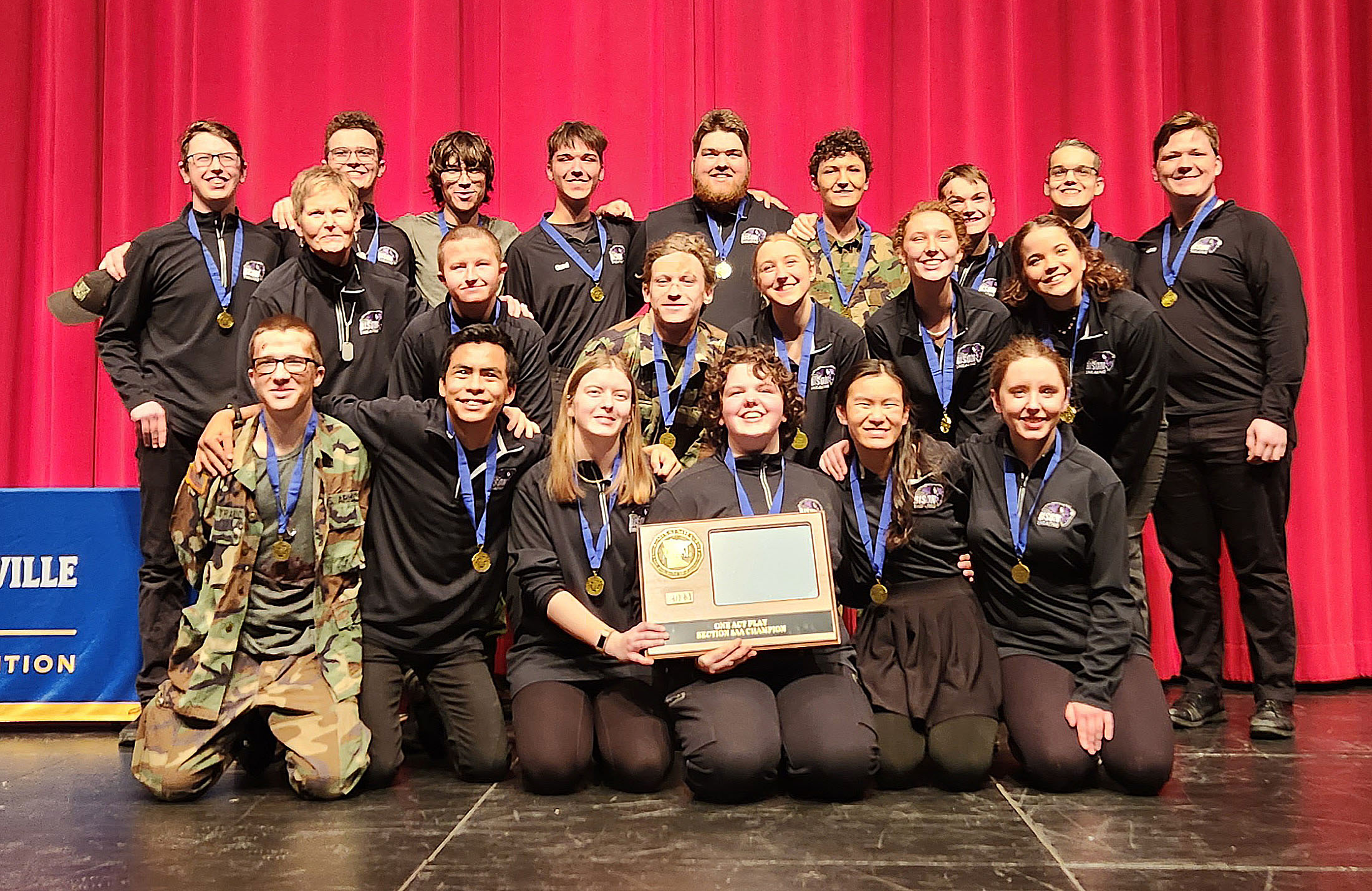 Cast and crew hold trophy