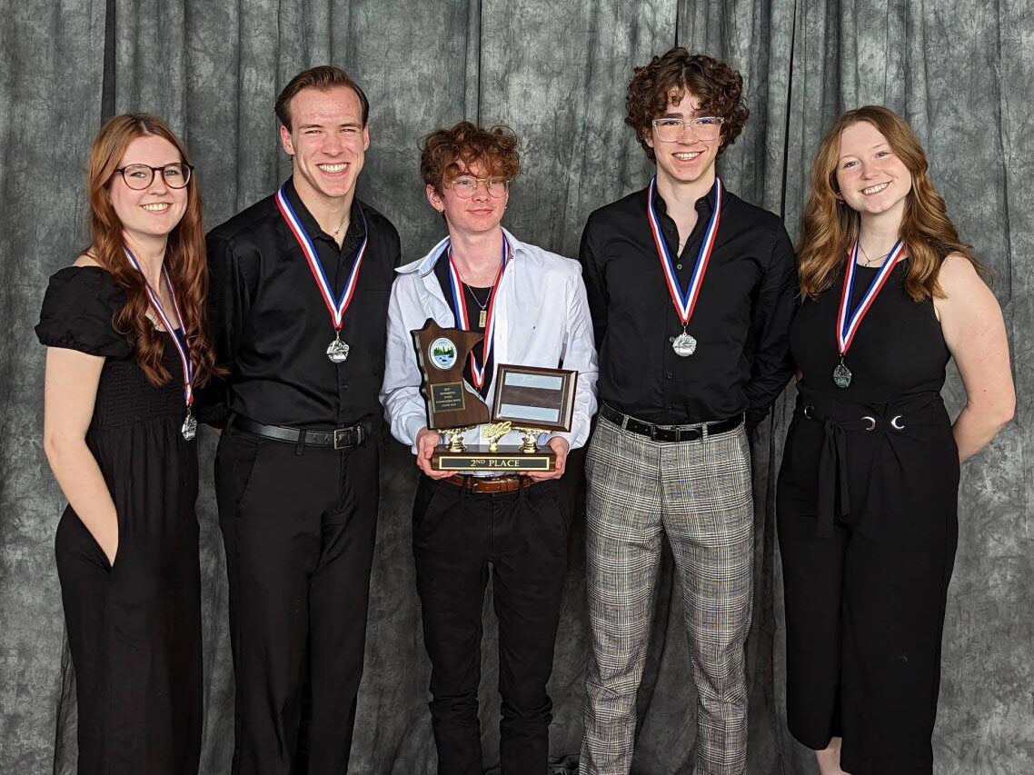 Students hold second-place trophy