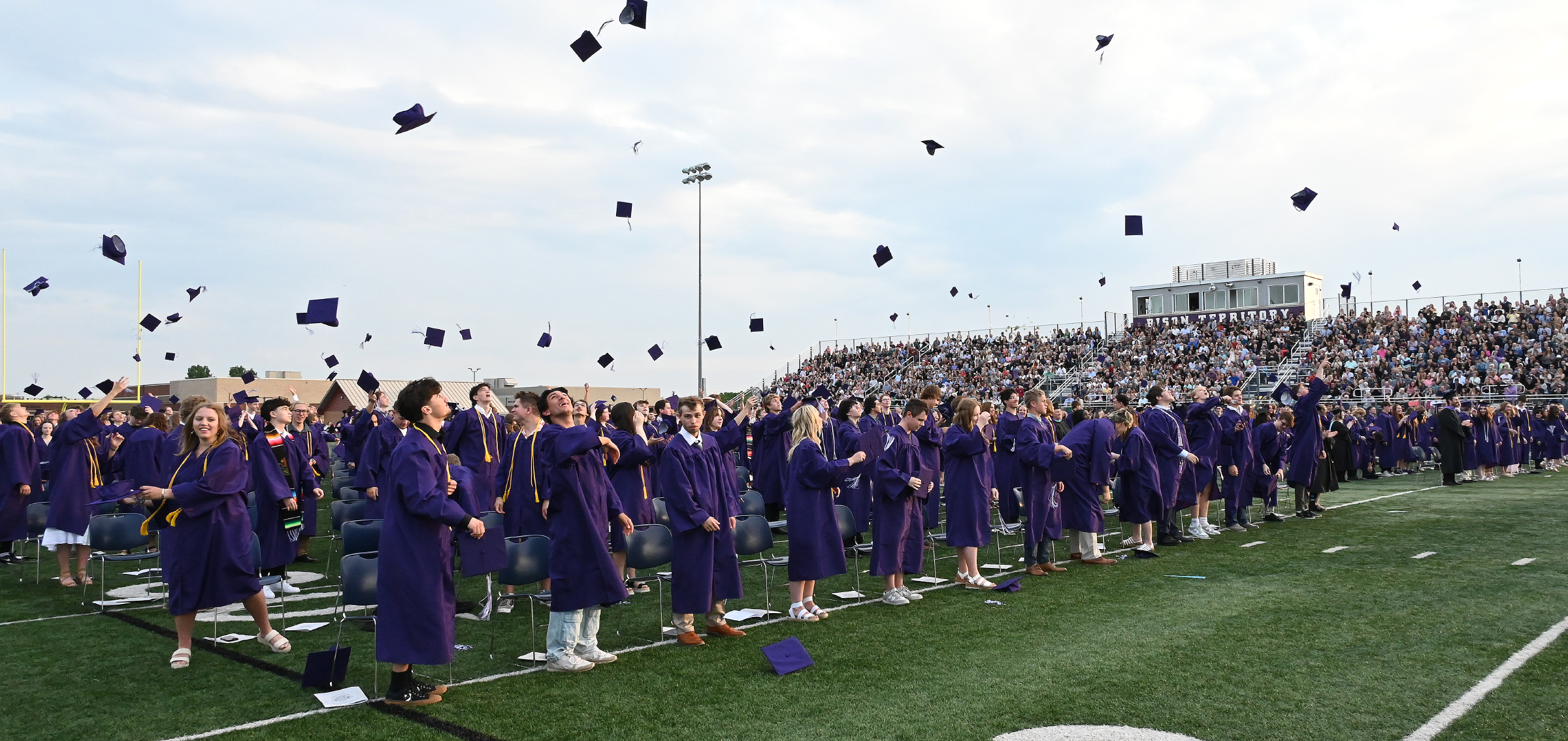 grads throwing caps