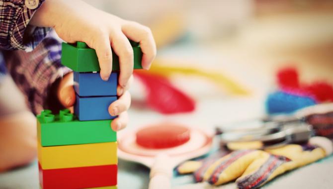 child stacking blocks