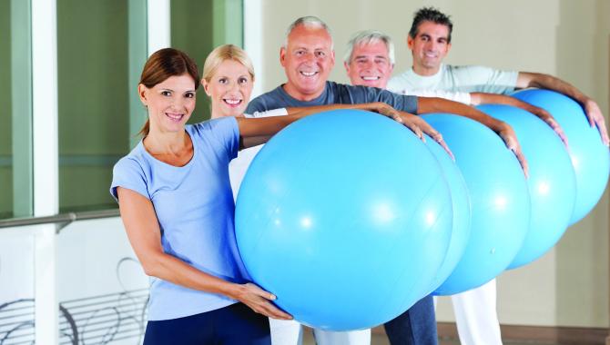 Exercise class with fitness balls