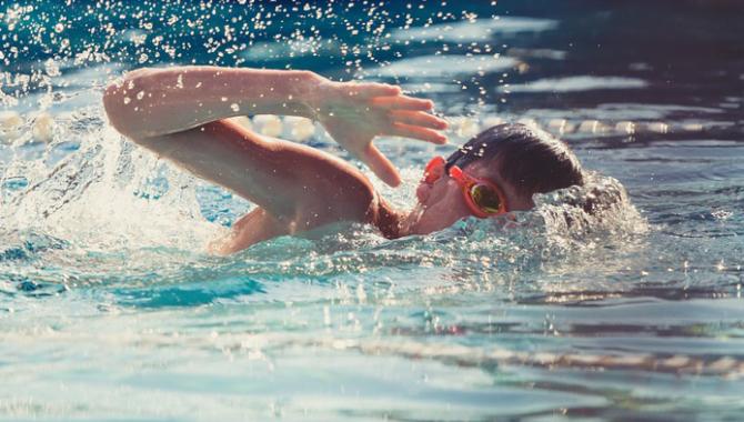 Boy swimming in pool