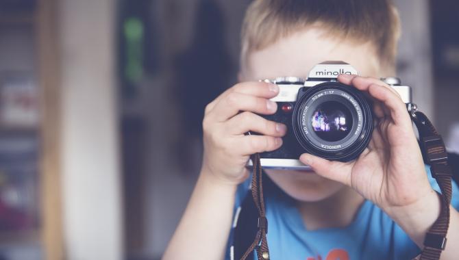 child with camera