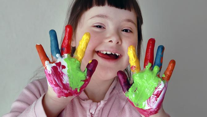girl with fingers and hands painted