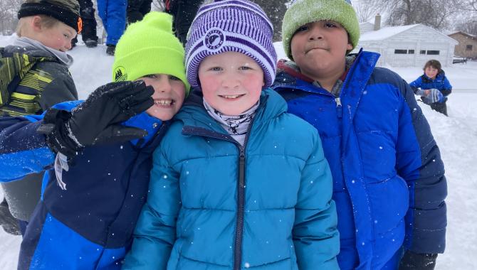 Student outside at recess in winter