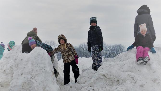 Students playing in snow