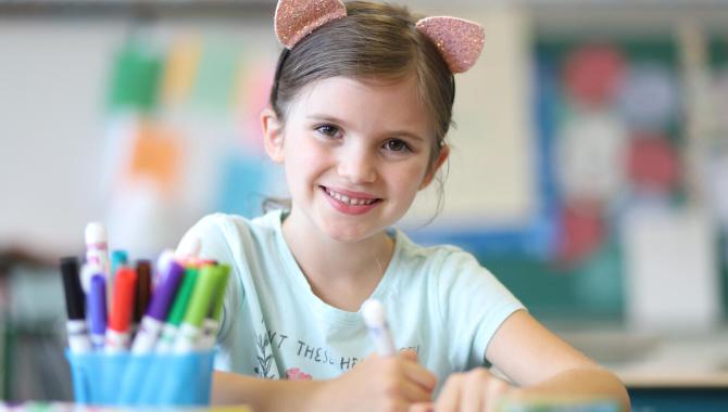 student at her desk