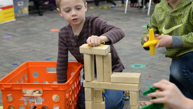 Student playing with blocks