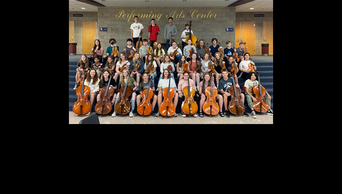 Orchestra students pose for photo