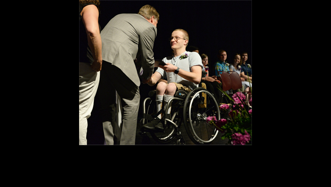 Student in wheelchair receives diploma