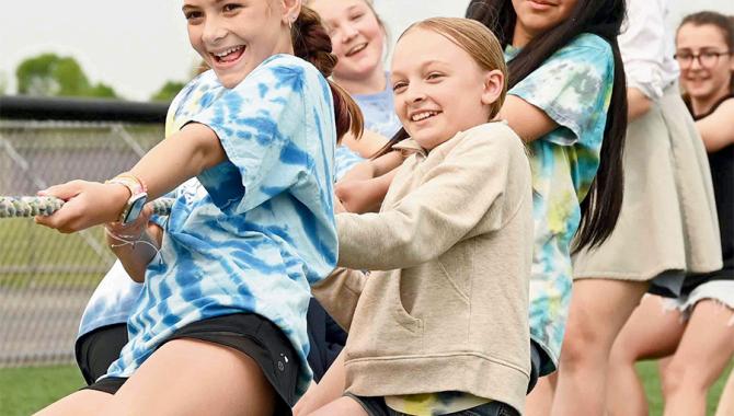Students playing tug of war.