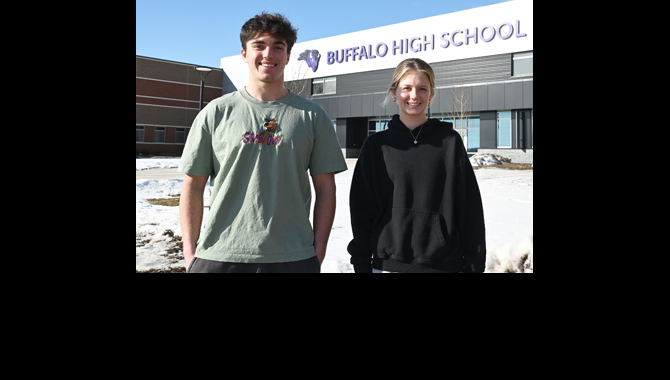 Students standing in front of school