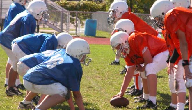 Youth playing football