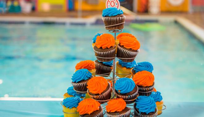 Cupcakes on a table by a pool