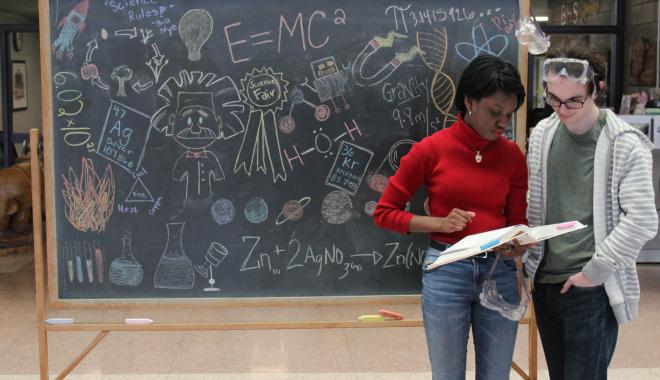 students by a chalkboard