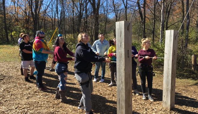 students on a ropes course