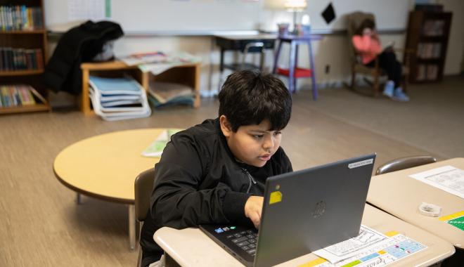 Student with Chromebook