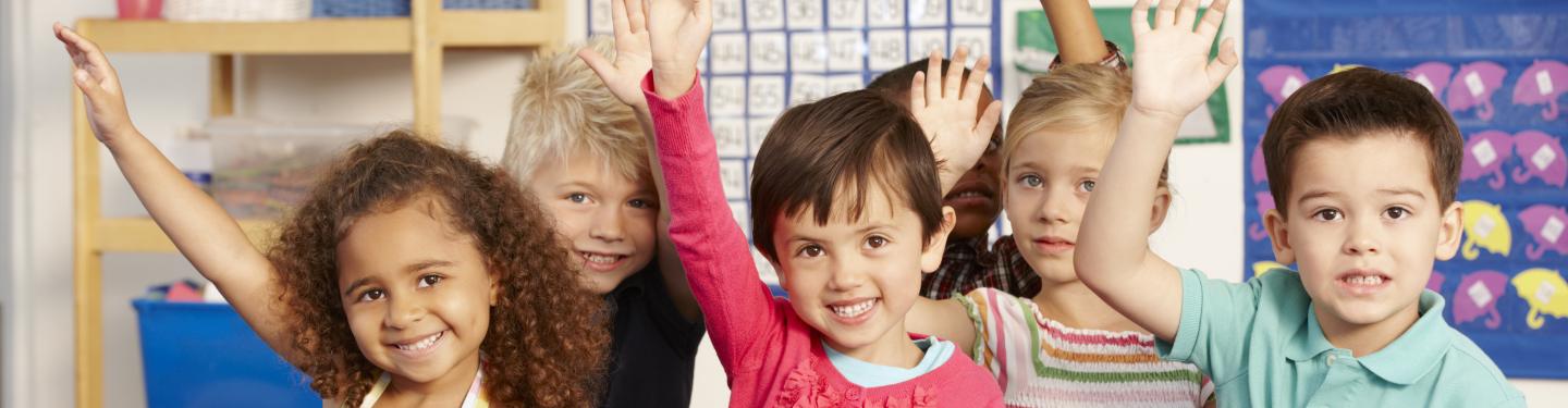 Children raising their hands