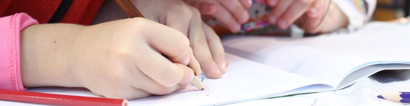 Kids writing with pencil