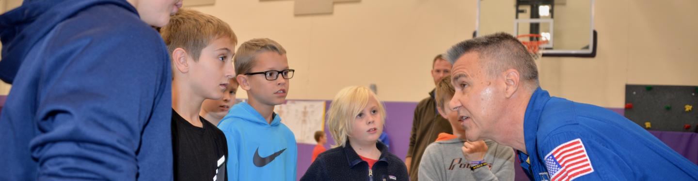 NASA Astronaut Duane Carey visits with Tatanka Elementary students