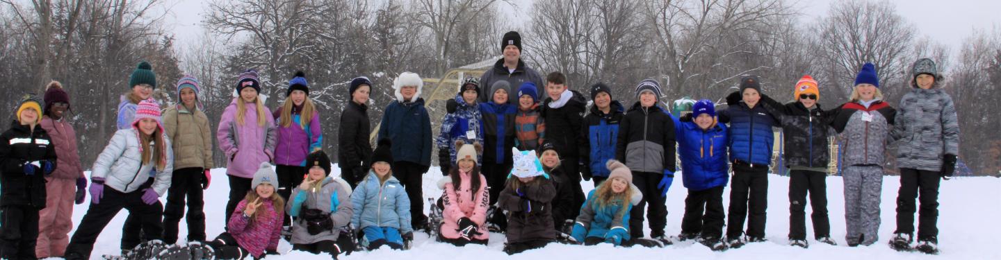 students snowshoeing