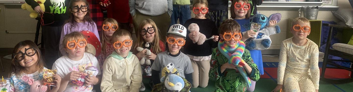 Students with stuffed animals and glasses