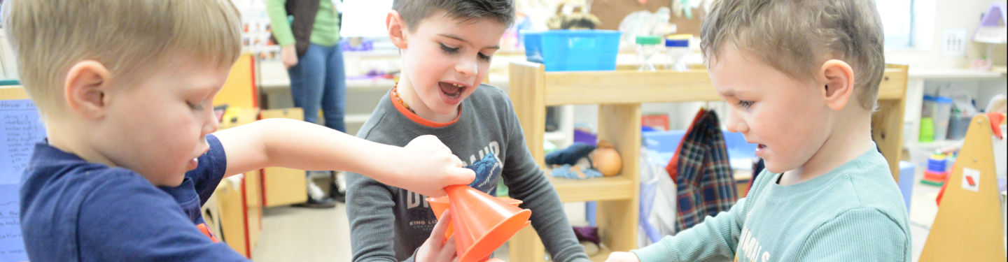 PreK students playing with sand table