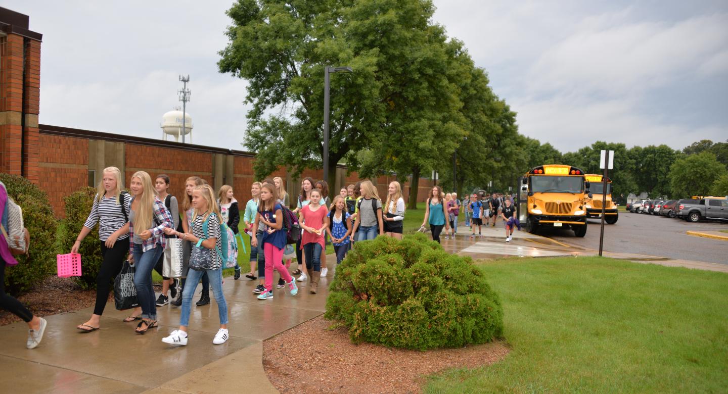 Bus dropping off students at school