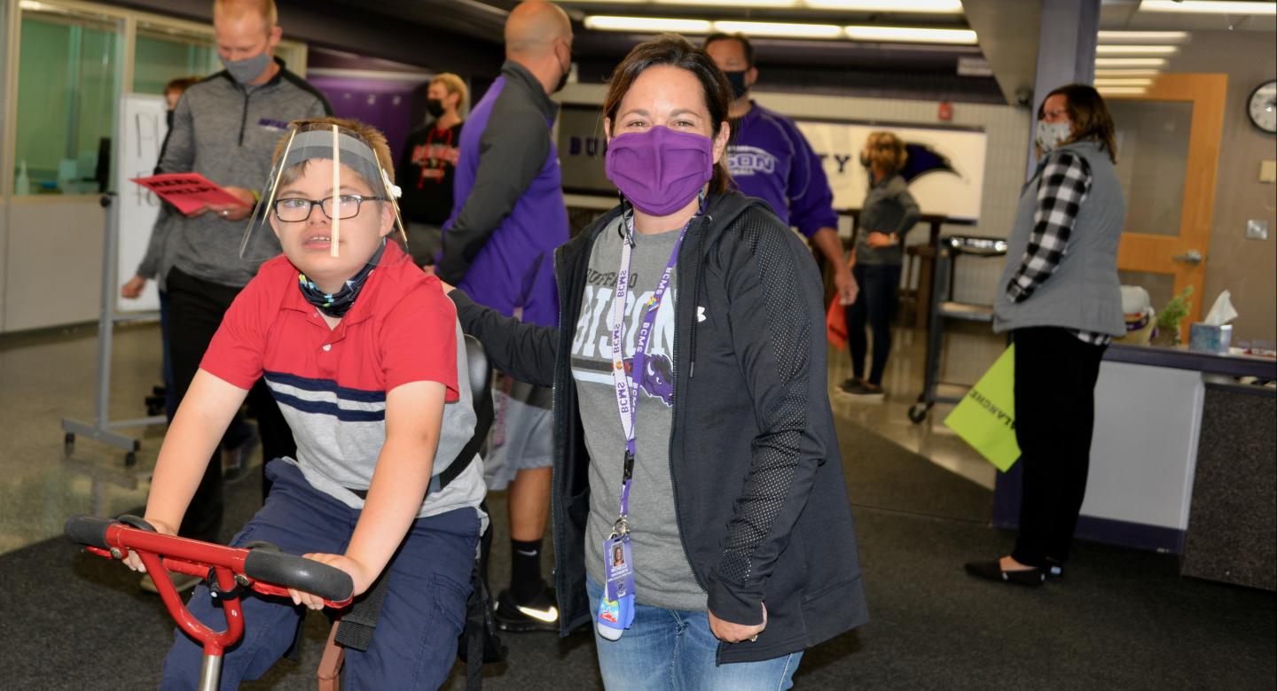 student riding a bike