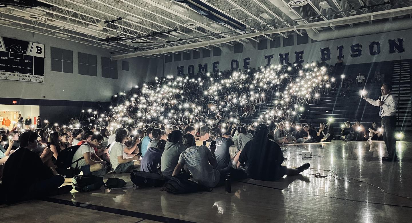 Students light the gym with phones