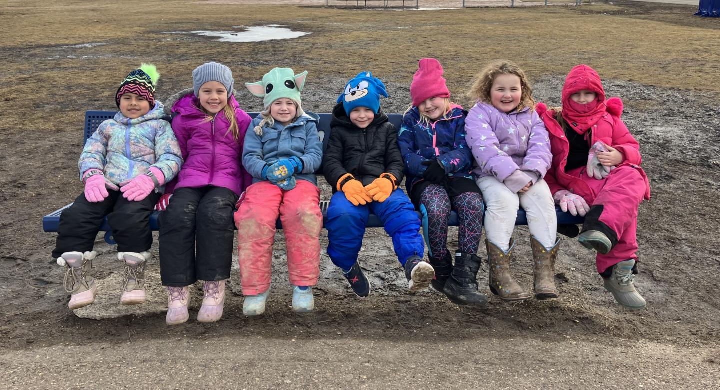 Students sitting on Buddy Bench at recess