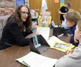 Teacher working with students