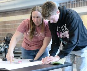 Geologist works with students