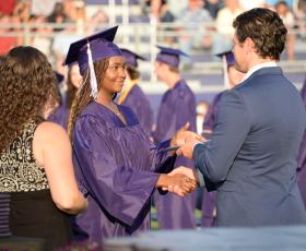 Student receives her diploma