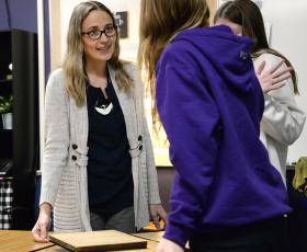 Teacher working with students