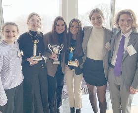 Mock trial students with trophies