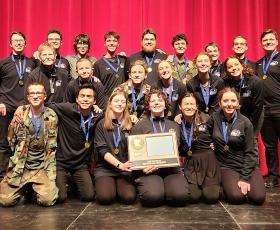 Cast and crew with award