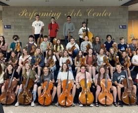 Orchestra students pose for photo