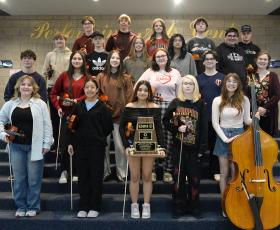 Members of the Repertory Orchestra pose with their trophy