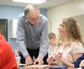 Teacher instructs students