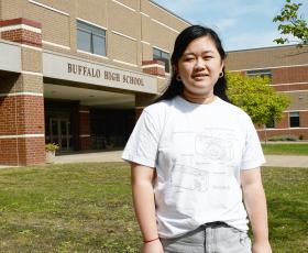 Lexi Zeng stands outside Buffalo High School