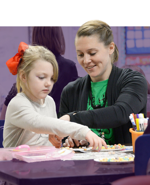 Teacher working with student