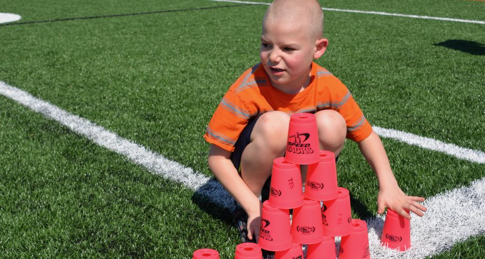 kid with cups