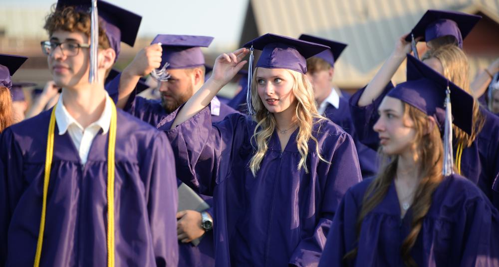 Graduates move their tassels