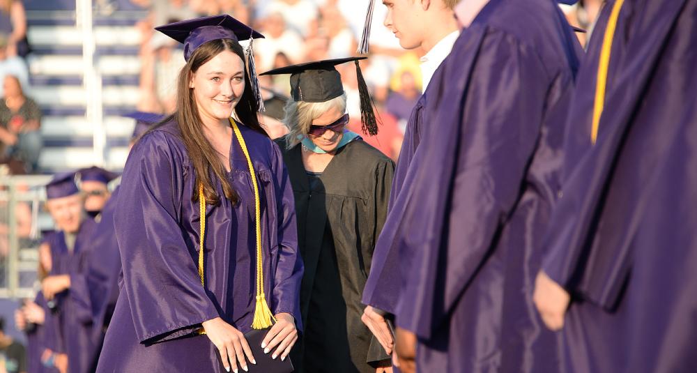 Graduate returns to her seat