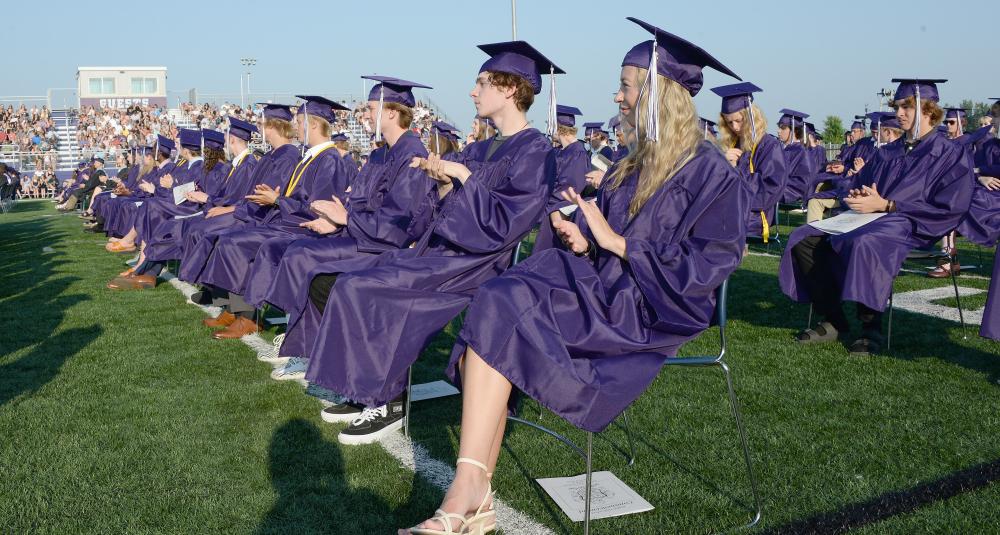 Graduates wait to receive diplomas