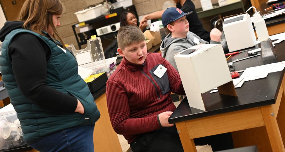 Student building a solar project